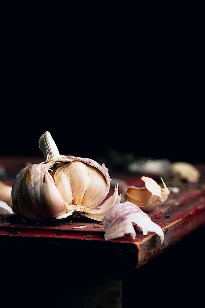 an image of garlic on a cutting board