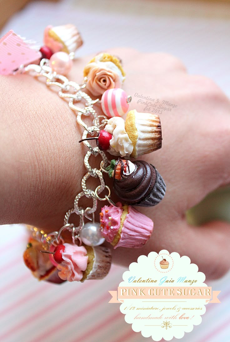 a close up of a person wearing a bracelet with cupcakes and candy on it