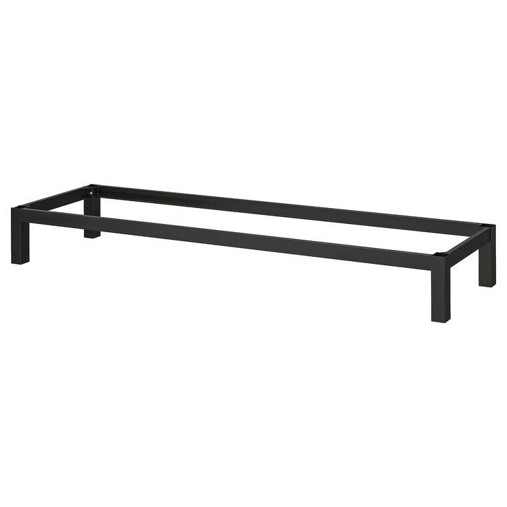 a black metal shelf with two legs