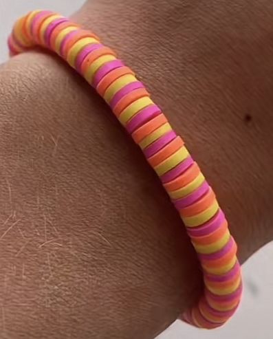 a person's arm with a colorful bracelet on it