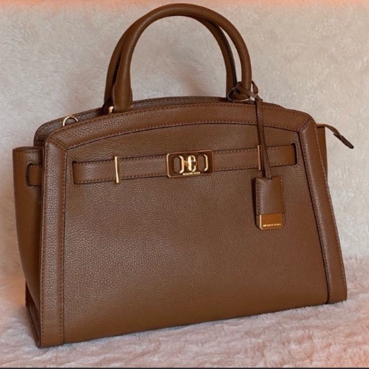 Michael Kors Karson Bag In Color Luggage. Crossbody Strap Included. Crafted From Pebbled Leather With Polished Hardware, This Satchel From Michael Michael Kors Is Simply Irresistible. -Medium Sized Bag; 12-3/4"W X 9-3/4"H X 5-1/2"D (Width Is Measured Across The Bottom Of Handbag); 2.03 Lbs. Approx. Weight -4-1/2"L Handles; 19"L To 21"L Adjustable Removable Strap -Zip Closure -Gold-Tone Exterior Hardware -1 Interior Zip Pocket & 4 Front Slip Pockets Brown Top Handle Box Bag With Branded Hardware, Brown Box Bag With Branded Hardware And Top Handle, Brown Box Bag With Branded Hardware For Travel, Brown Box Bag With Branded Hardware For Daily Use, Travel Satchel Box Bag With Branded Hardware, Travel Box Bag With Double Handle And Branded Hardware, Office Tote Box Bag With Branded Hardware, Classic Gold Satchel With Branded Hardware, Tan Box Bag With Gold-tone Hardware For Shopping