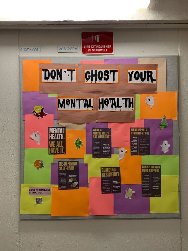 a bulletin board that has been taped to the side of a wall with words on it