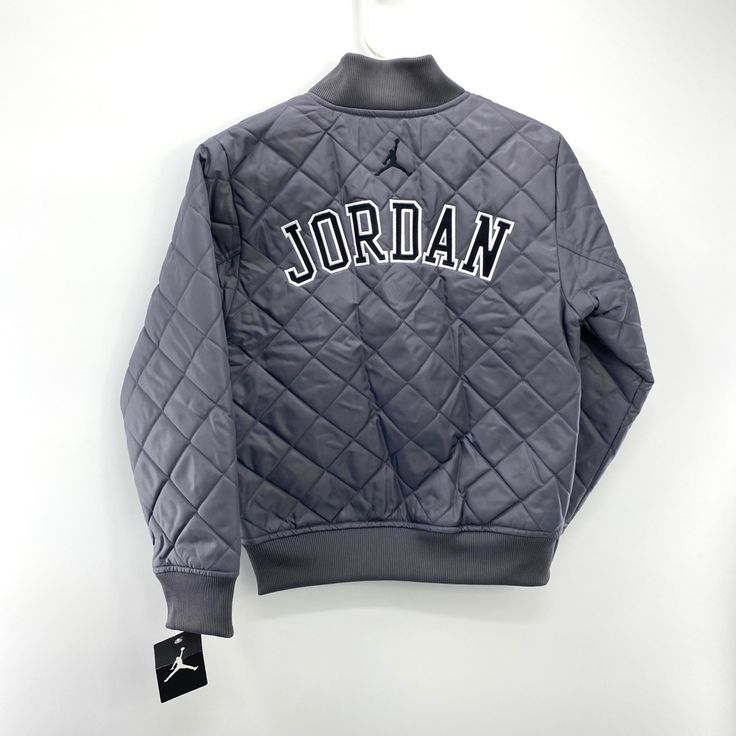 Nike Jordan Quilted City Of Flight ‘Wolf Grey’ Full Zip Jacket Size: 4 96-100cm 3-4 Years Old Size: 6 110-116cm 5-6 Years Old Size: 7 116-122cm 6-7years Old New With Tags A117- A122 Gray Outerwear With Ribbed Cuffs For Cold Weather, Heather Grey Hooded Outerwear For Fall, Heather Grey Outerwear For Fall Streetwear, Heather Grey Fall Outerwear For Streetwear, Gray Winter Outerwear With Ribbed Cuffs, Sporty Gray Outerwear With Fleece Lining, Urban Gray Outerwear For Cold Weather, Heather Grey Long Sleeve Streetwear Outerwear, Heather Grey Long Sleeve Outerwear For Streetwear