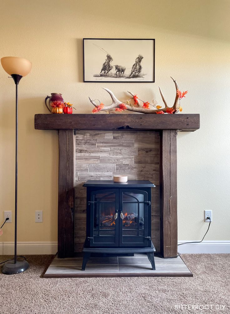 a living room with a fire place and pictures on the wall