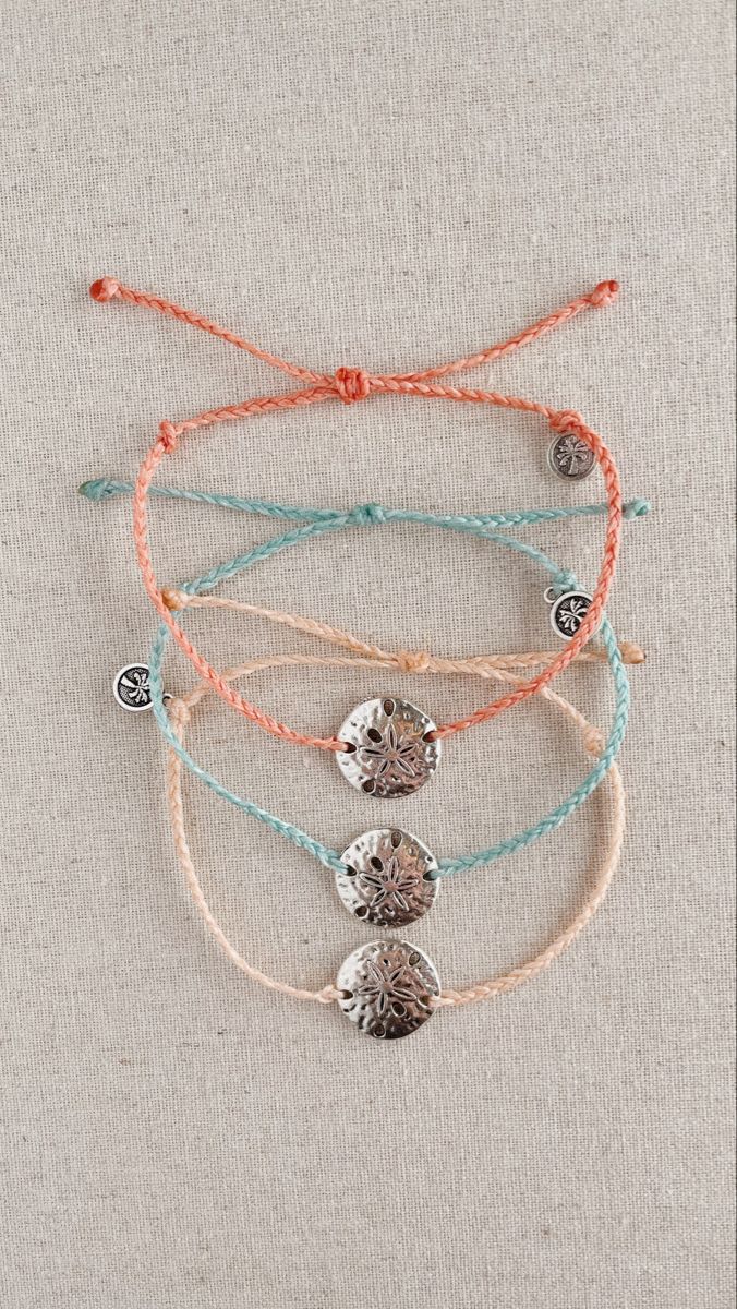 Handmade, 100% waterproof braided friendship bracelet with an adorable sand dollar charm, availible in 4 different colors! Braided Friendship Bracelet, Braided Strap, Sand Dollar, Dress Sewing, Dress Sewing Patterns, Friendship Bracelet, Charm Bracelets, Sewing Dresses, At The Beach