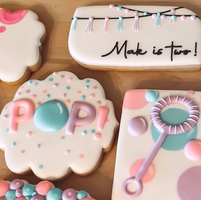 decorated cookies with the words pop spelled on them