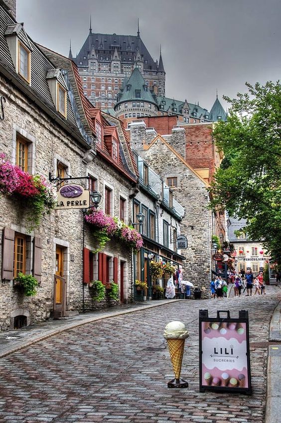 a cobblestone street lined with stone buildings