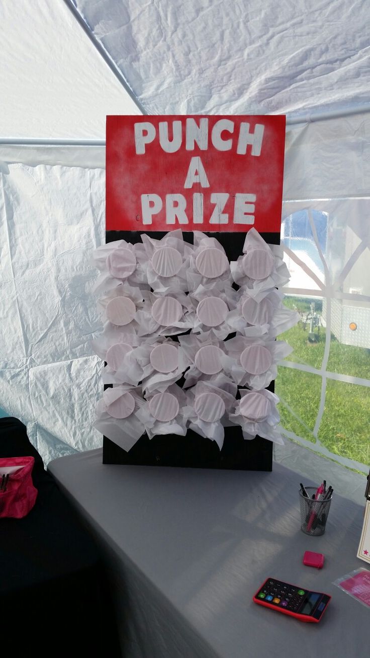 a table with a sign that says punch a prize