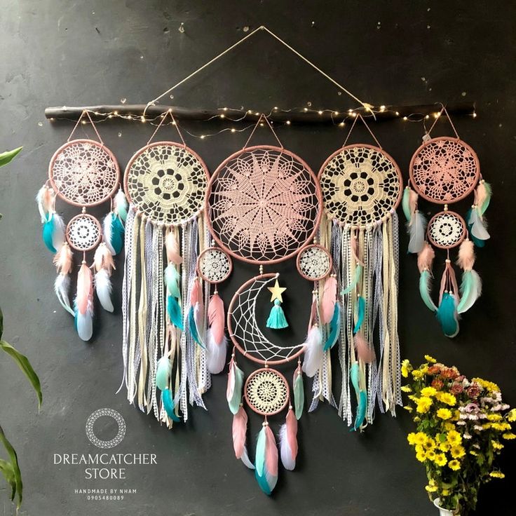 several dream catchers hanging on the wall