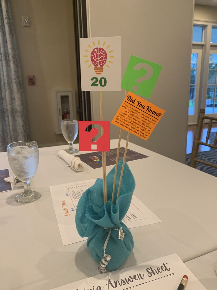 the table is set up for someone to have their name written on it and place cards in front of them