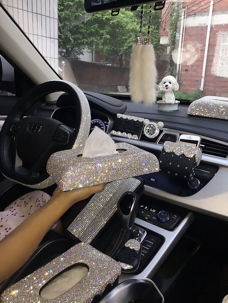 the interior of a car is decorated with silver sequins