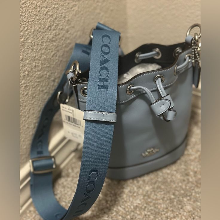 New With Tags Coach Mini Bucket Bag. Comes With Attachable Strap! Luxury Blue Shoulder Bucket Bag, Blue Trendy Bucket Bag With Handles, Luxury Blue Bucket Bag, Designer Blue Rectangular Bucket Bag, Coach Blue Shoulder Bag With Silver-tone Hardware, Blue Luxury Pouch Bucket Bag, Luxury Blue Pouch Bucket Bag, Designer Light Blue Bag With Detachable Strap, Designer Light Blue Bags With Detachable Strap