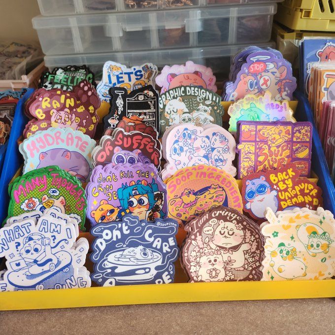 there are many decorated cookies on display in the bins at the store, including one for sale