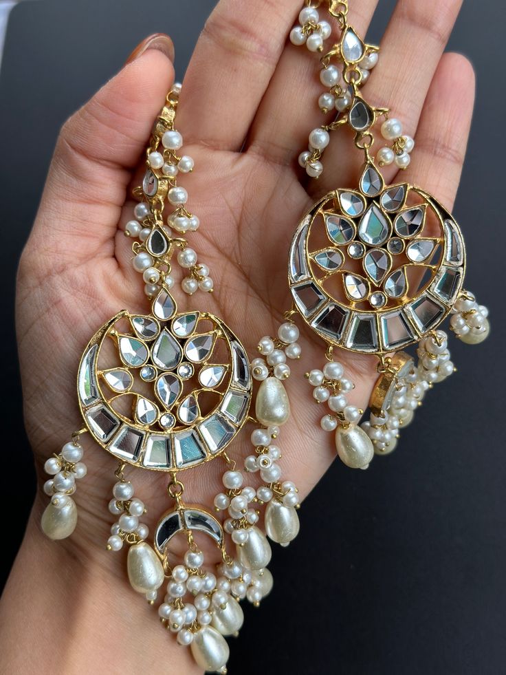 Mirror work and gold plated, this set is perfect for bridesmaid or mehendi/Sangeet to wear with any outfit! Elegant Kundan Jhumkas With Gota Work, Party Jewelry With Zari Work For Festivals, Elegant Chandbali Jhumkas With Gota Work, Elegant Chandelier Earrings With Gota Work For Wedding, Elegant Kundan Tikka With Zari Work, Elegant Bridal Earrings With Gota Work For Festive Occasion, Wedding Chandbali Jhumkas With Matching Earrings, Elegant Gold Bridal Earrings With Zari Work, Elegant Festive Jhumkas With Gota Work