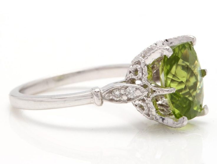 3.00 Carats Impressive Natural Peridot and Diamond 14K White Gold Ring Suggested Replacement Value: Approx. $2,000.00 Total Natural Peridot Weight is: Approx. 2.92 Carats Peridot Measures: Approx. 10.00 x 8.00mm Natural Round Diamonds Weight: Approx. 0.08 Carats (color G-H / Clarity SI1-SI2) Ring total weight: Approx. 4.0 grams Disclaimer: all weights, measurements and colors are approximate and may vary slightly from the listed dimensions or as seen in the image. All pictures are magnified to s Etsy Gold Ring, Blue Sapphire Diamond, Natural Blue Sapphire, 14k White Gold Ring, White Gold Ring, Sapphire Diamond, Quality Diamonds, Yellow Gold Rings, White Gold Rings