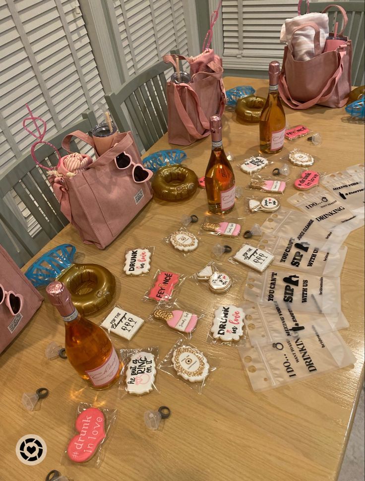 the table is covered with pink bags and other items that have been placed on it