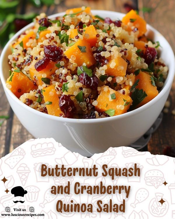 butternut squash and cranberry quinoa salad in a white bowl on a wooden table