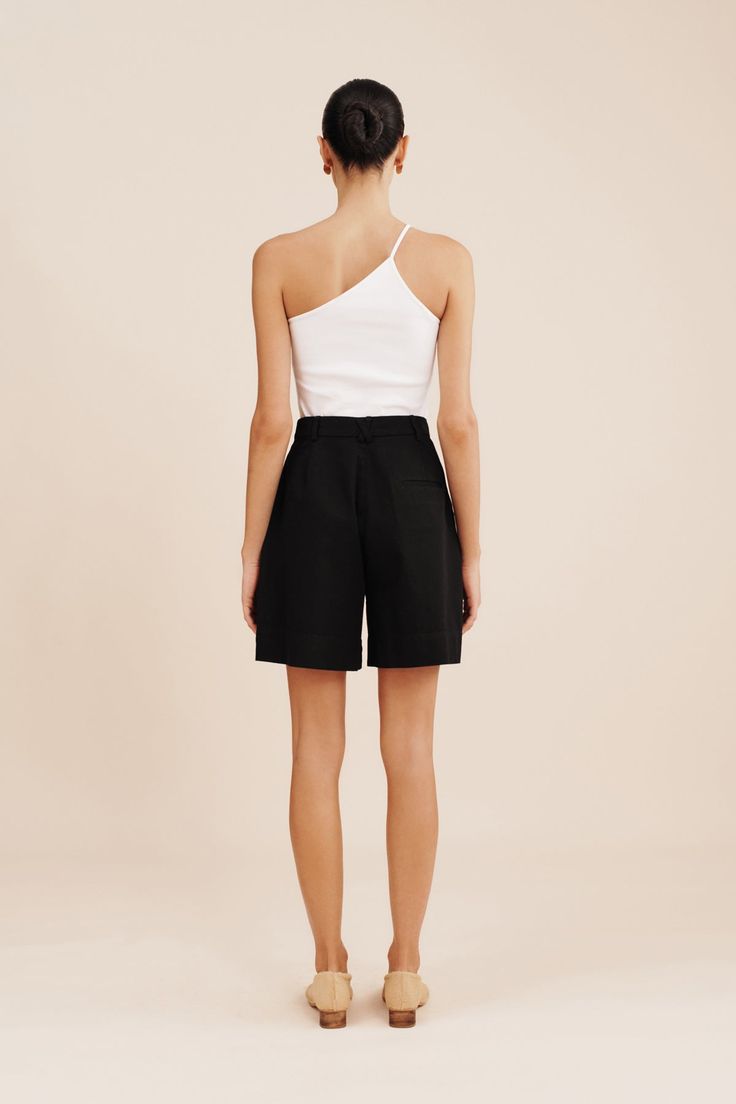 The wear-everywhere Wesley Shorts have a bermuda style, relaxed silhouette. They're cut from 100% cotton and are pleated just below the flattering high-rise waist. High waisted style Double hook and bar opening Concealed centre front fly zip Internal adjustable waistband Belt loops Front pleats Side seam pockets Functional back welt pockets Material: 100% Cotton Made in a BSCI and WRAP certified factory High Waist Fashion, Adjustable Waistband, Sleepwear & Loungewear, Welt Pockets, Evening Wear, Short Pants, Dress Skirt, Knitwear, Lounge Wear