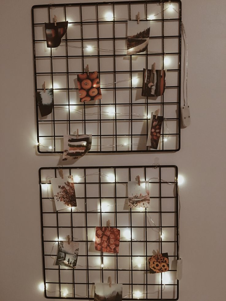 two metal racks with lights and cookies on them