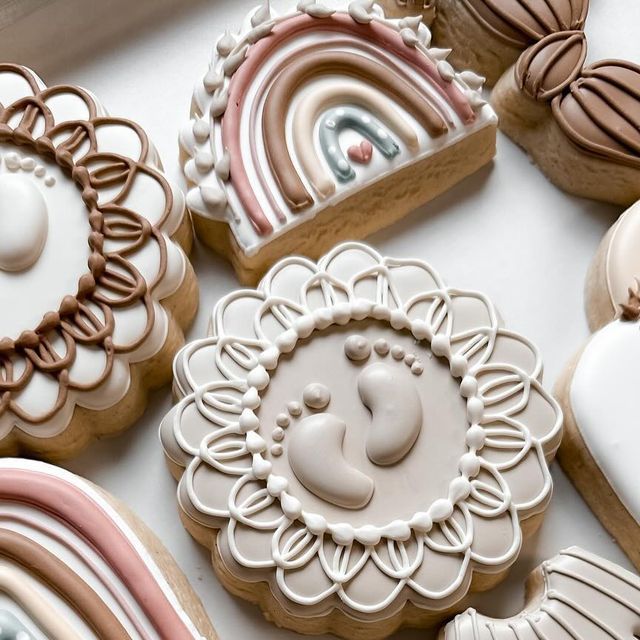 decorated cookies are displayed on a table