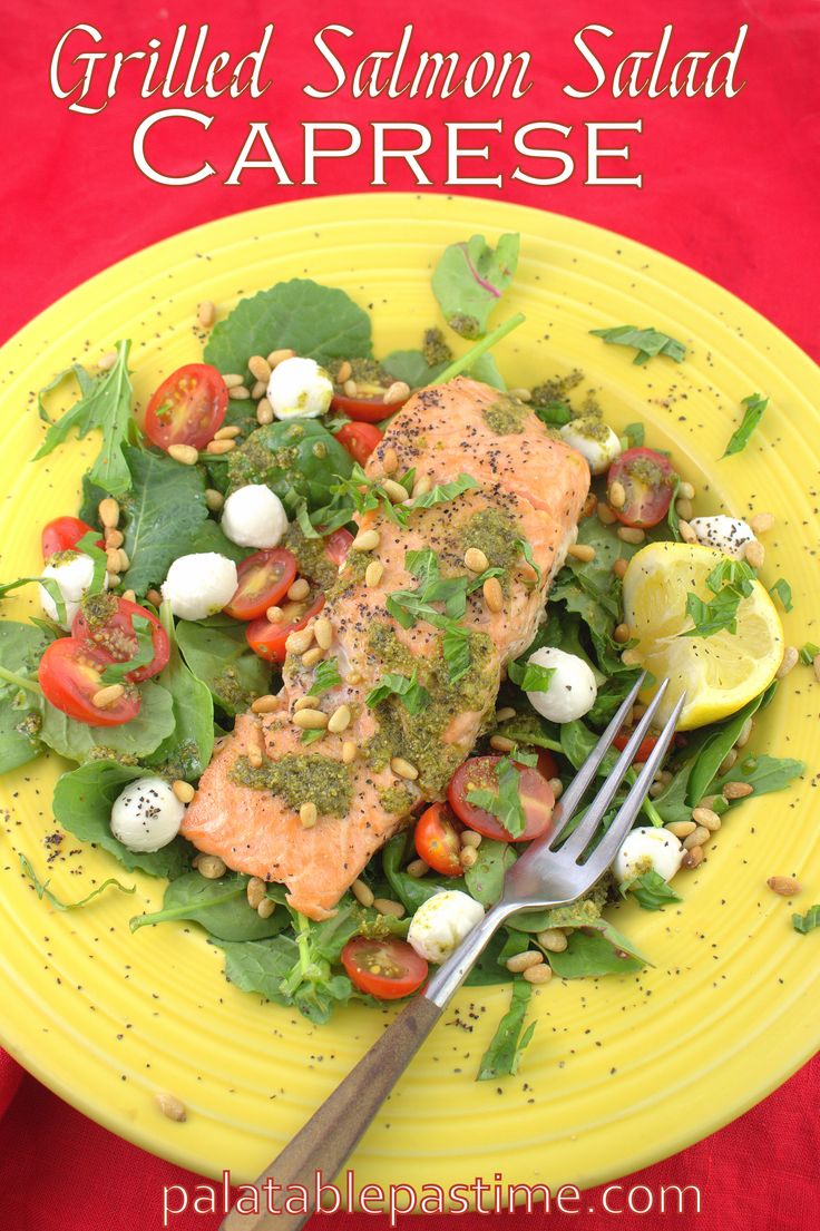 grilled salmon salad with caprese on a yellow plate