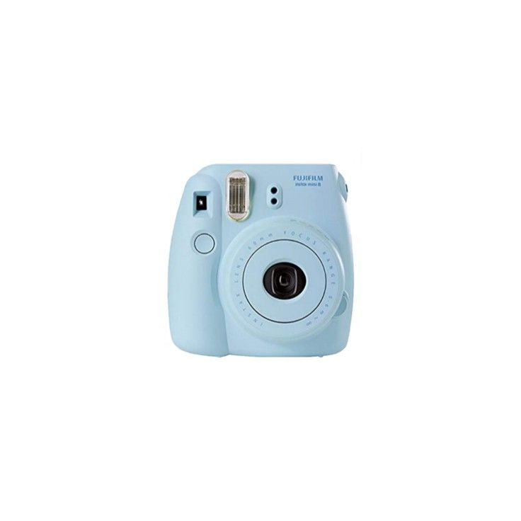 a blue camera sitting on top of a white surface