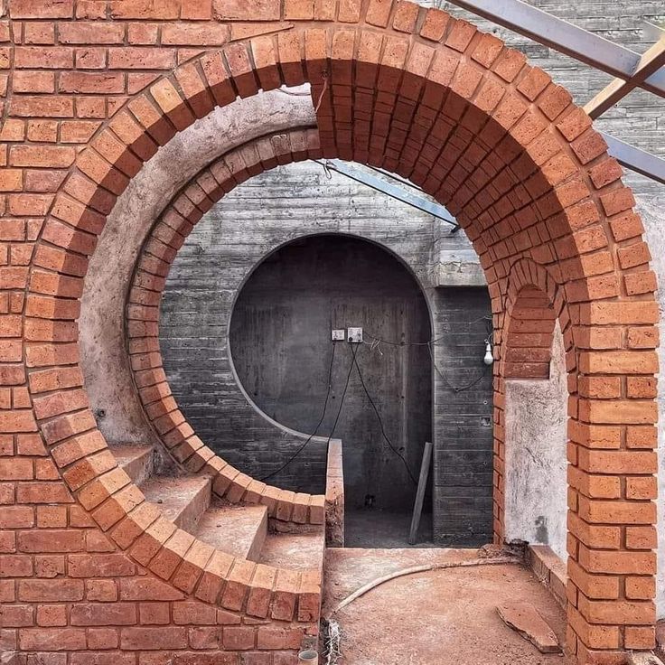 an image of a brick tunnel in the middle of a building that is under construction