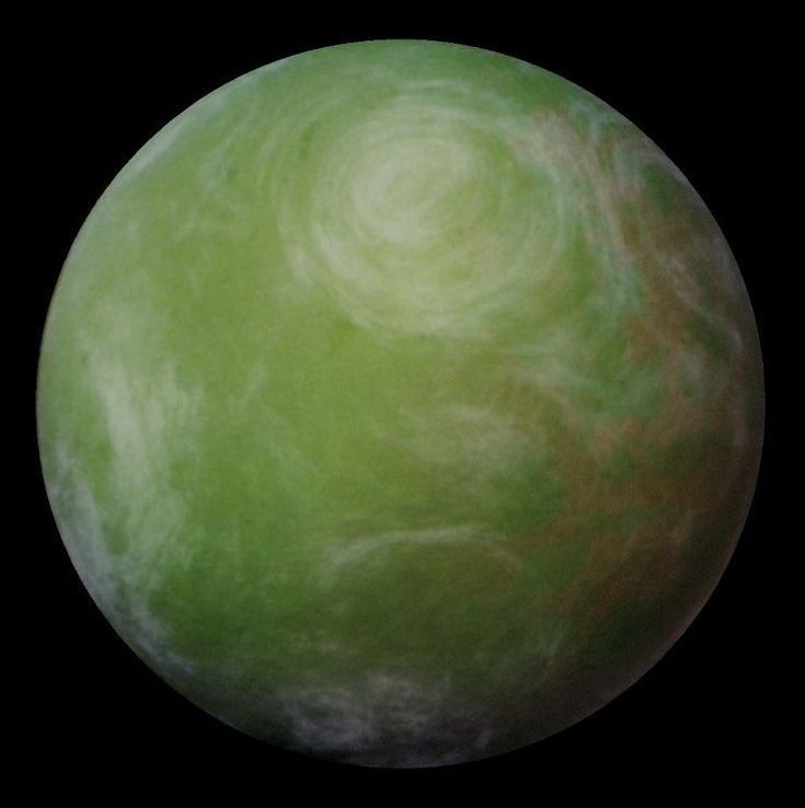 an image of a green planet on a black background