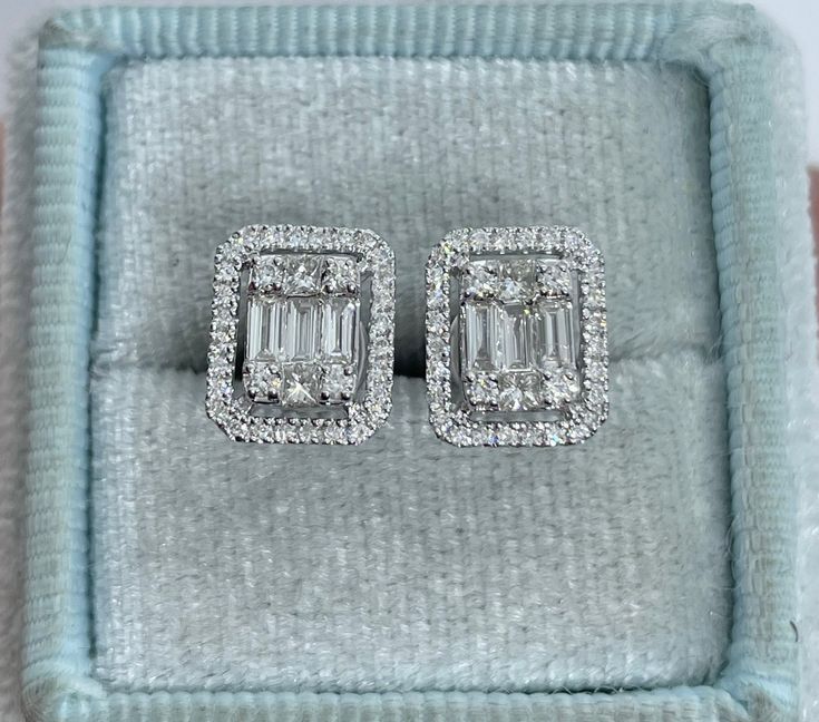 Classy Diamond Earrings Emerald Cut Halo Studs. Nice size earrings you can dress up or down with. Excellent craftsmanship, all diamonds are set smooth. Sits nice on the ear, the halo of diamonds gives a lot of sparkles. These square shapes are a bit different than your everyday round ones. The push backings have double notches for a secure fit. Measures 9.8 x 8mm. These diamonds are sparkling, no visible black carbon spots. Genuine Round, Princess and Baguette Cut Diamonds Total weight: 0.61 Car Square Shape Diamond Earrings, Diamond Square Earrings, Emerald Cut Earrings, Emerald Cut Diamond Earrings, Square Diamond Studs, Square Diamond Earrings, Emerald Cut Halo, Halo Earrings Studs, Halo Earrings