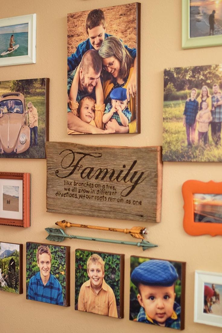 family pictures are hung on the wall with magnets