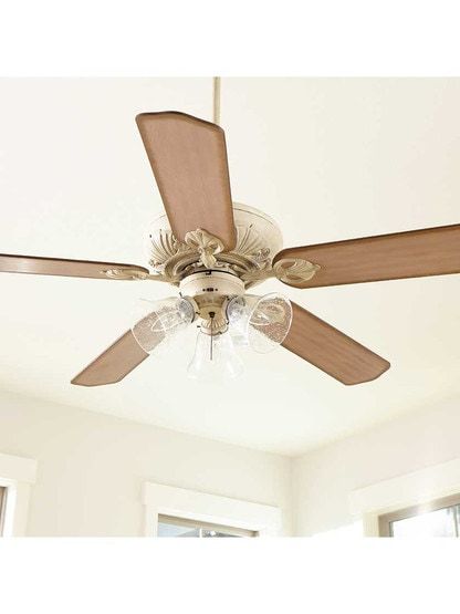 a ceiling fan with three lights in a room