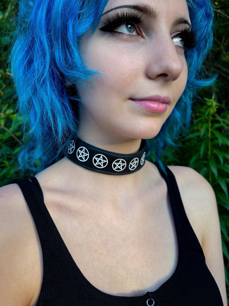 Pentagram Choker, Pentacle necklace, Gothic necklace, Goth choker - House of Raige, Apparel and Accessories - Handcrafted in Buffalo, NY, USA Durable and Comfortable. Made with Vinyl Leather (Faux Leather) 65% Vinyl, 35% Viscose Adjustable sizing. Fits between 13 1/2 - 16 inches Band is 1 inch wide and 17 inch in length. **Disclaimer** Due to the nature of our hand-crafted items, there may be some variation in our products.  This may include sizing, color, and shape. Your monitor may affect how Pentagram Choker, Pentacle Necklace, Mermaid Moon, Gothic Choker, Goth Choker, Girls Y2k, Choker Black, Gothic Chokers, Necklace Gothic