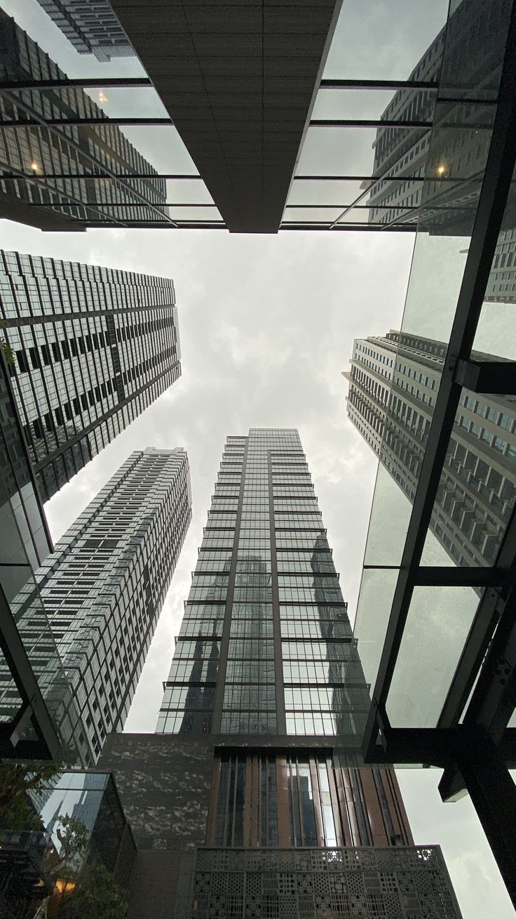 looking up at tall buildings from below