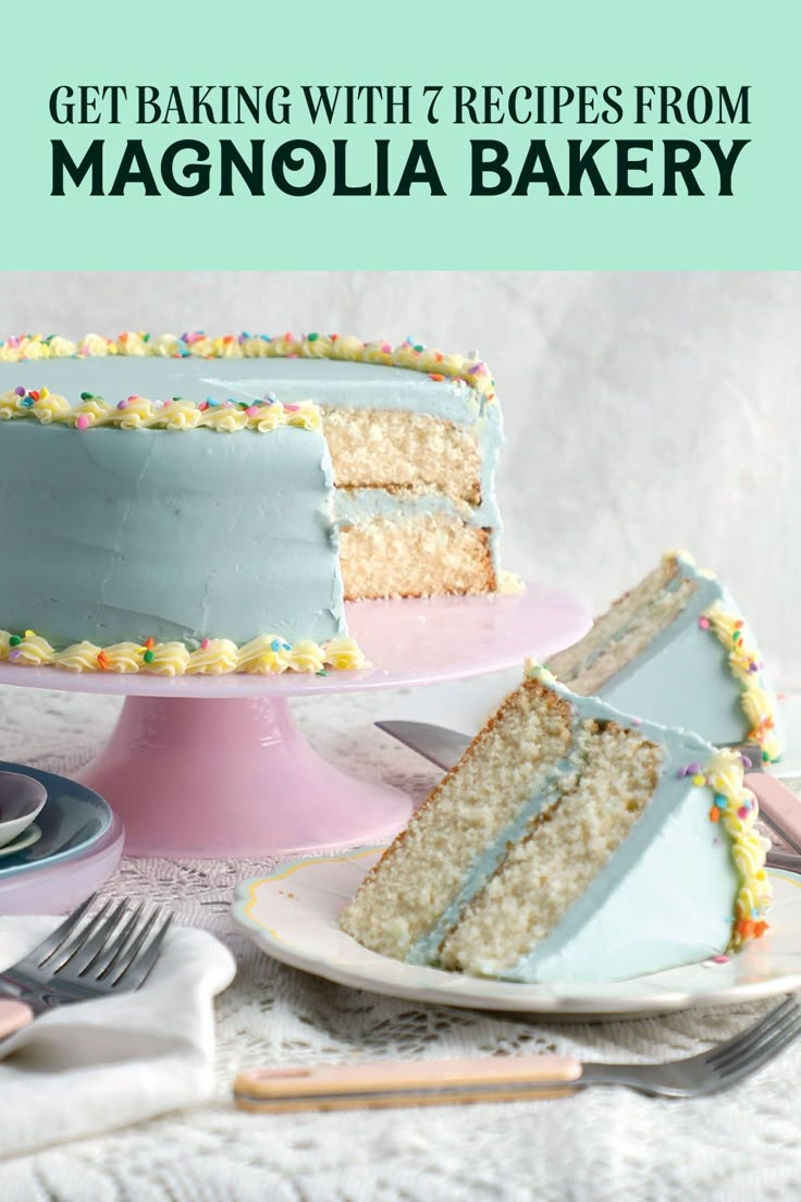 a cake with blue frosting and sprinkles sitting on top of a table