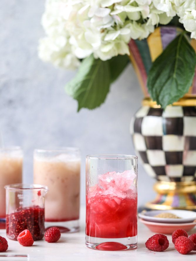 raspberry lemonade punch in glasses with fresh raspberries on the side