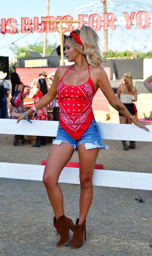 This bandana halter top in rich red is crafted from 100% rayon and features an adjustable tie back and neck for a perfect fit. Flattering and comfortable and light weight. Model is 5'8" with measurements of 33-25-33. One size Red festival top made in the U.S.A. OUR GUARANTEE TO YOU: If you are not 100% satisfied with your purchase, you can return your order to us within 30 days for a refund, exchange or store credit. Shipping charges are not refundable. (Returns must be unworn, in the state you Trendy Red Halter Neck Tank Top, Red Halter Neck Tank Top For Summer, Bohemian Bandana For Beach In Summer, Red Summer Halter Top With Tie Back, Red Halter Neck Tank Top For Beach, Red Halter Neck Tank Top For The Beach, Fitted Red T-back Halter Top, Summer Festival Red Tank Top, Red Tank Top For Summer Festivals