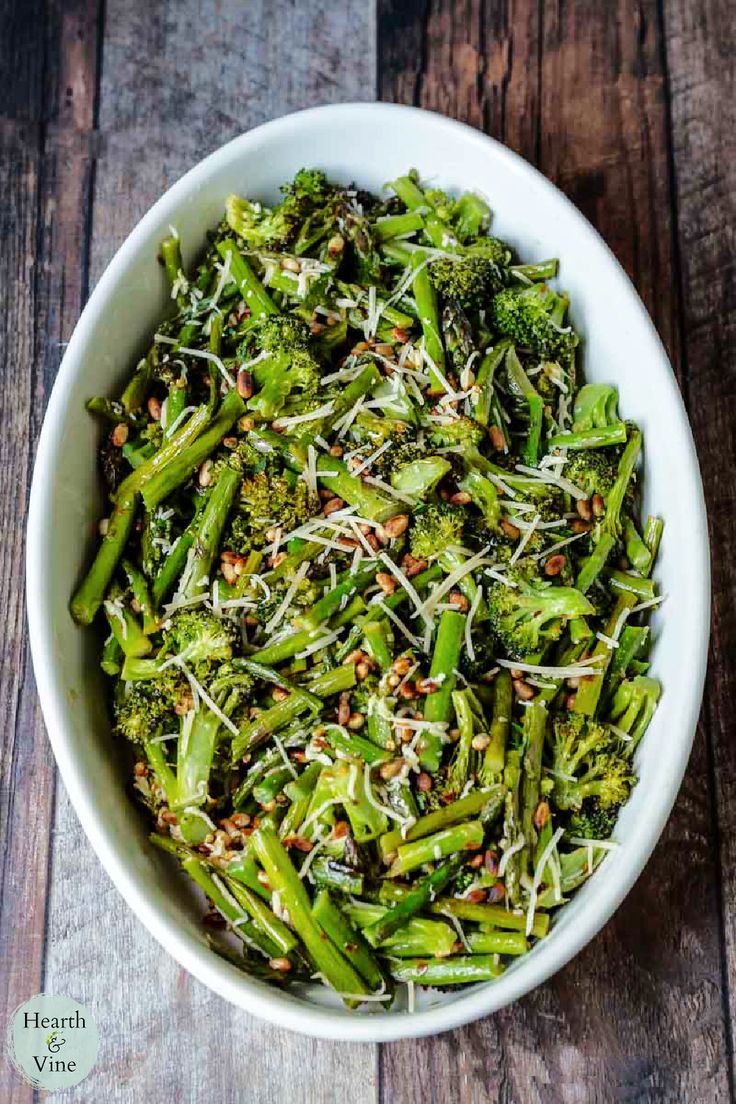 a white bowl filled with broccoli and sprouts