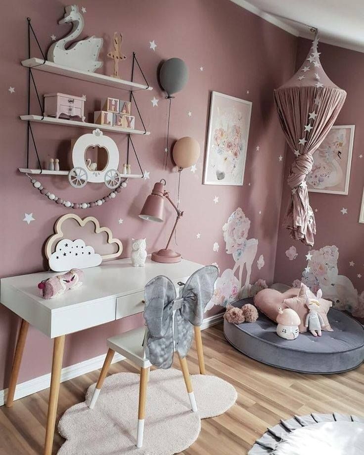 a child's room decorated in pink and white