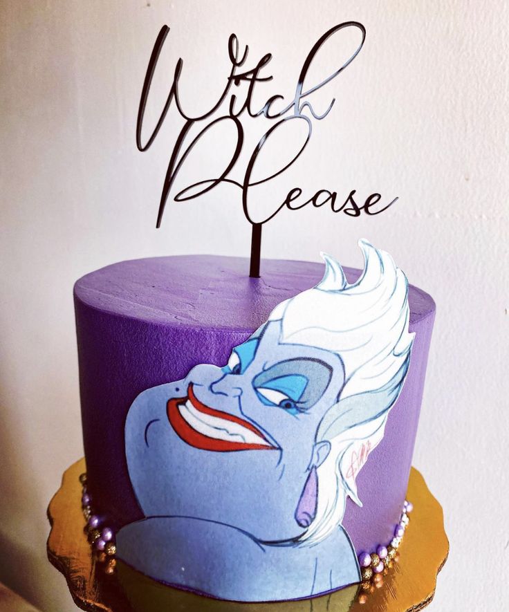 there is a purple cake with an evil face on it and the words we're here please