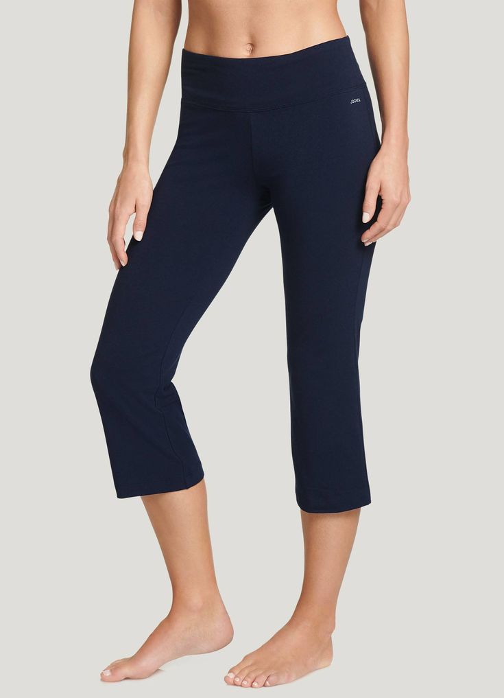 The Jockey® Cotton Stretch Slim Flare Capri is an essential addition to your workout or casual wardrobe. So versatile, it can go from your morning yoga class to a quick lunch with friends to an afternoon filled with errands. The soft, breathable fabric feels great against your skin, and stretches with you as you move. The moisture-wicking liner helps keep you dry and comfortable. A hidden key pocket in the waistband helps keep small essentials safe. | Jockey® Cotton Stretch Slim Flare Capri in T Breathable Cotton Activewear For Loungewear, Comfortable Moisture-wicking Yoga Pants For Loungewear, Casual Comfort Stretch Yoga Pants For Gym, Casual Moisture-wicking Capris For Workout, Comfortable Go-dry Activewear For Loungewear, Yoga Sportswear With Comfort Waistband, Yoga Activewear With Comfort Waistband, Casual Moisture-wicking Capris For Gym, Moisture-wicking Athleisure Capris For Yoga