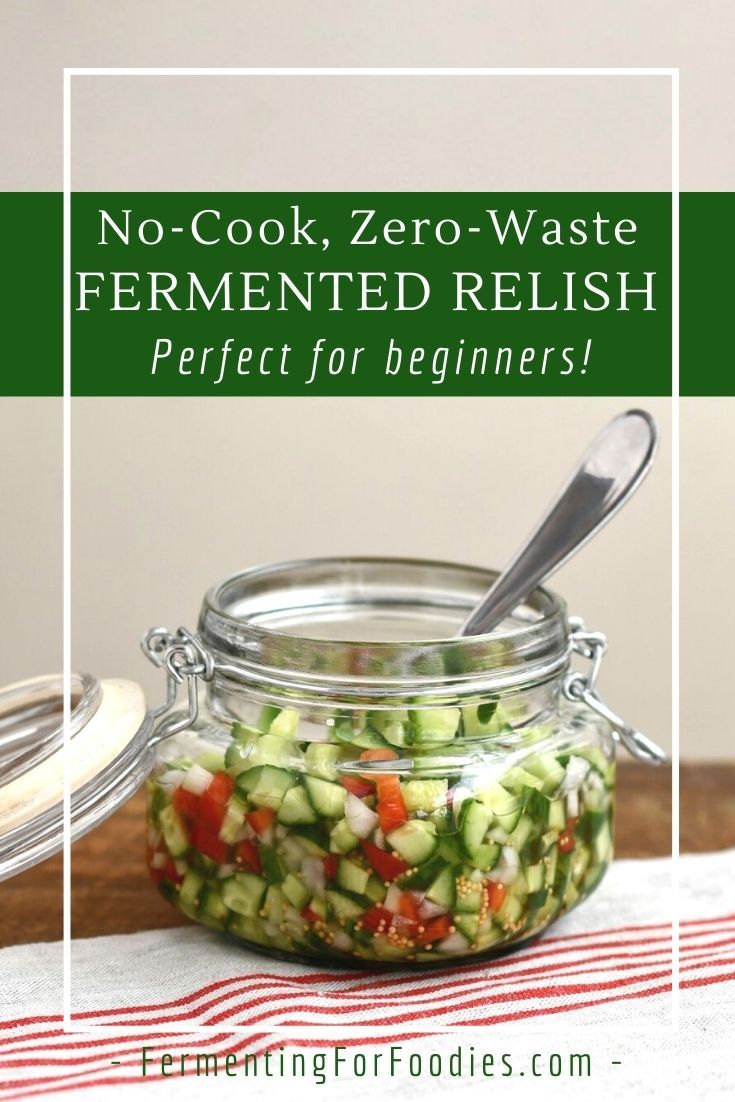 a jar filled with cucumber relish sitting on top of a table