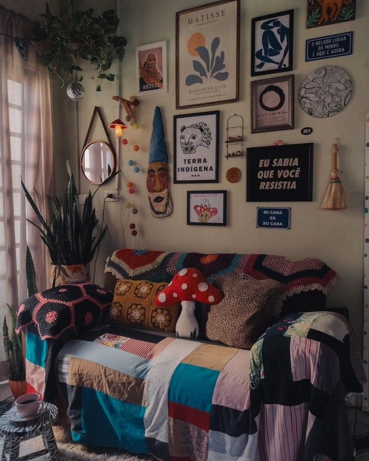 a living room filled with lots of pictures on the wall and furniture in front of it