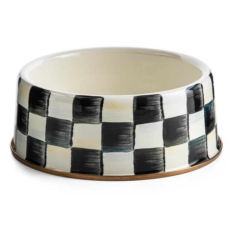 a black and white checkered dog bowl on a white background with gold trimmings