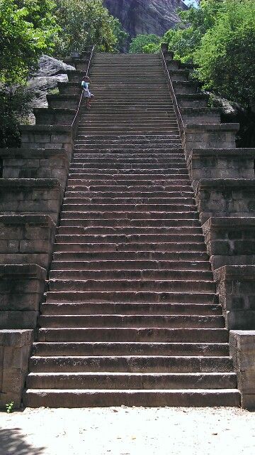 the stairs lead up to the top of the mountain