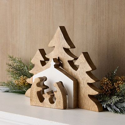 Create a sense of peace and harmony in your home with the Christmas Nativity Nesting Table Decoration. The natural mango wood gives it a rustic appeal while the unique nesting design adds depth and dimension to any display. Overall decoration measures 12L x 1W x 9H in. Crafted of solid mango wood Natural wood grain finish Nativity scene Nesting design Hues of brown and white Tabletop use Care: Dust with a soft, dry cloth. This item is available at Kirklands.com only, not available in stores. Ple Nativity Display, Rustic Winter Decor, Wood Nativity, Bookshelf Display, Traditional Holiday Decor, Country Christmas Decorations, Wood Christmas Tree, Christmas Nativity Scene, Christmas Wood Crafts