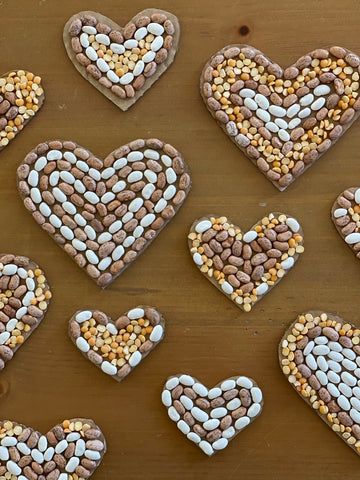 Cardboard Heart Seed Mosaics – Good Weekend Seed Art For Kids, Seed Mosaics, Seed Mosaic, Repurposed Cardboard, Cardboard Heart, Hispanic Heritage Month Crafts, Seed Craft, World Art Day, Afternoon Crafts