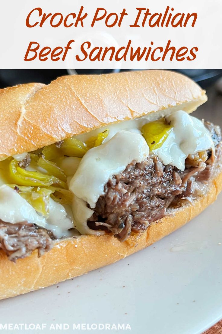 a close up of a sandwich on a plate with text overlay that reads crock pot italian beef sandwiches