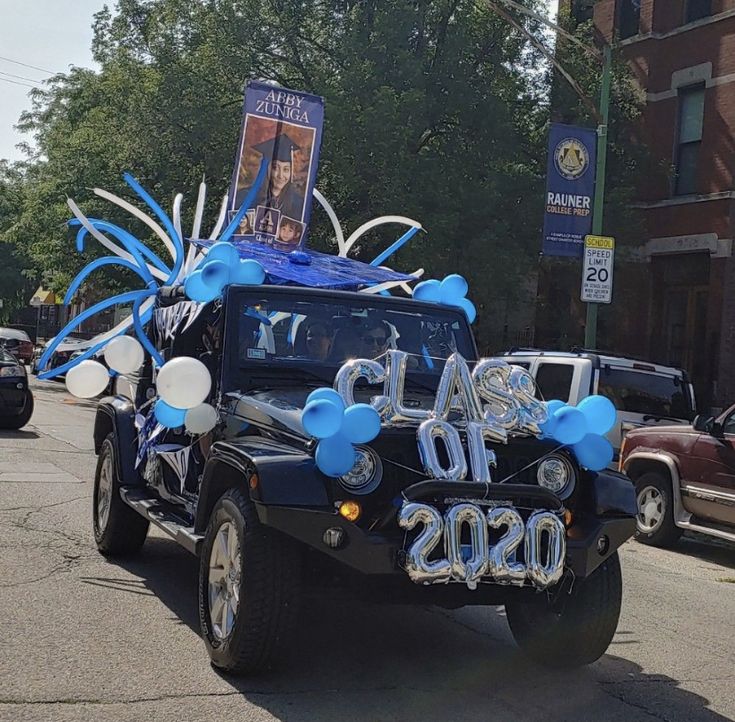 a jeep with balloons and streamers in the back