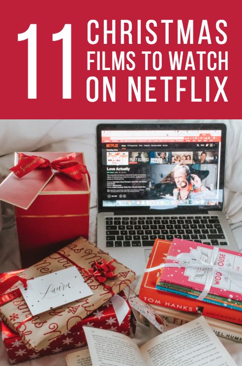 a laptop computer sitting on top of a bed next to christmas presents and books with the words 11 christmas films to watch on netflix