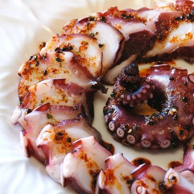 there are octopus wrapped in bacon on the plate